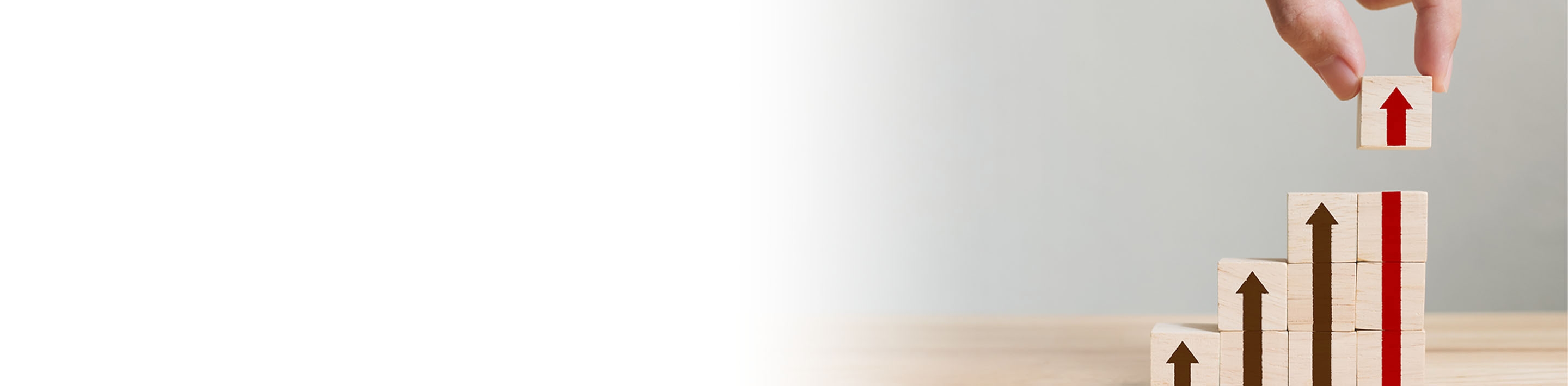 2880x710 left white gradient of a hand arranging wood block stacking as step stair with arrow up. Ladder career path concept for business growth success process