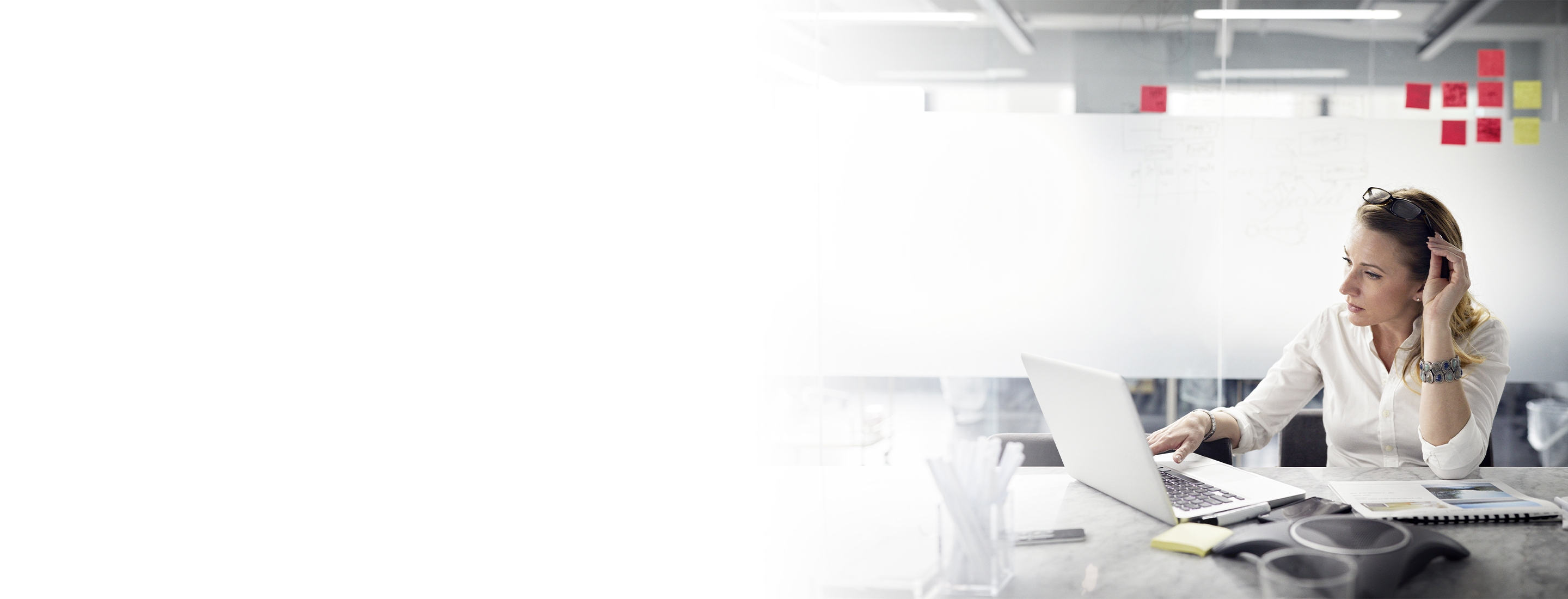 2880x1100 flipped horizontal left white gradient of businesswoman adjusting eyeglasses while using laptop computer in office