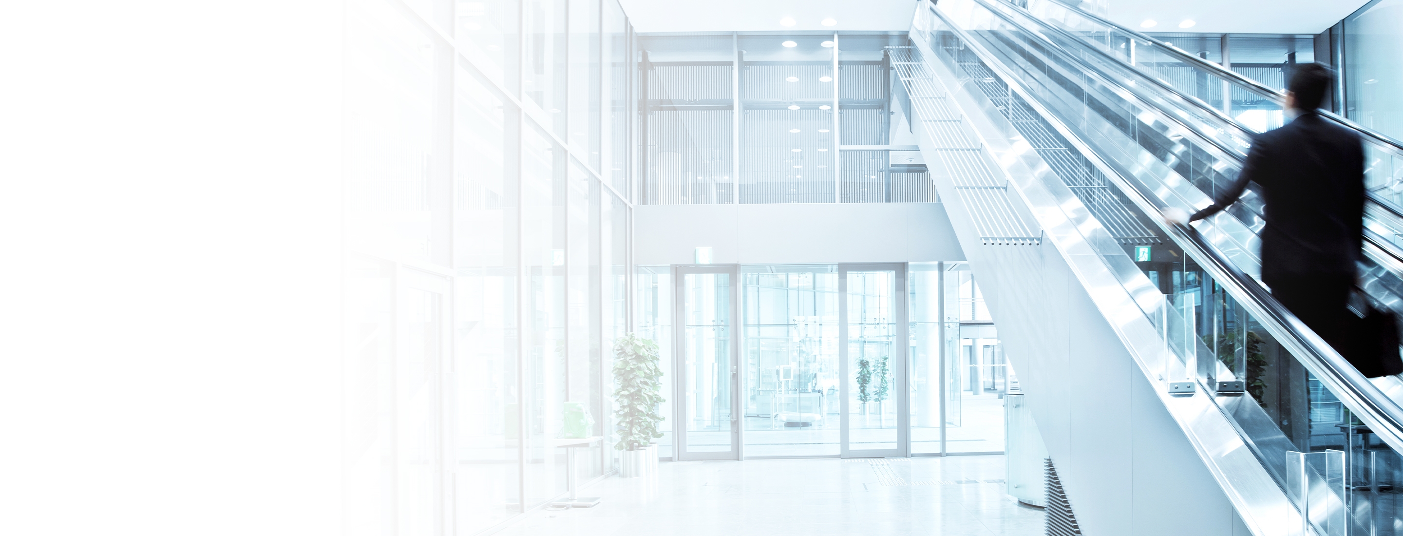 businessman on escalator going up