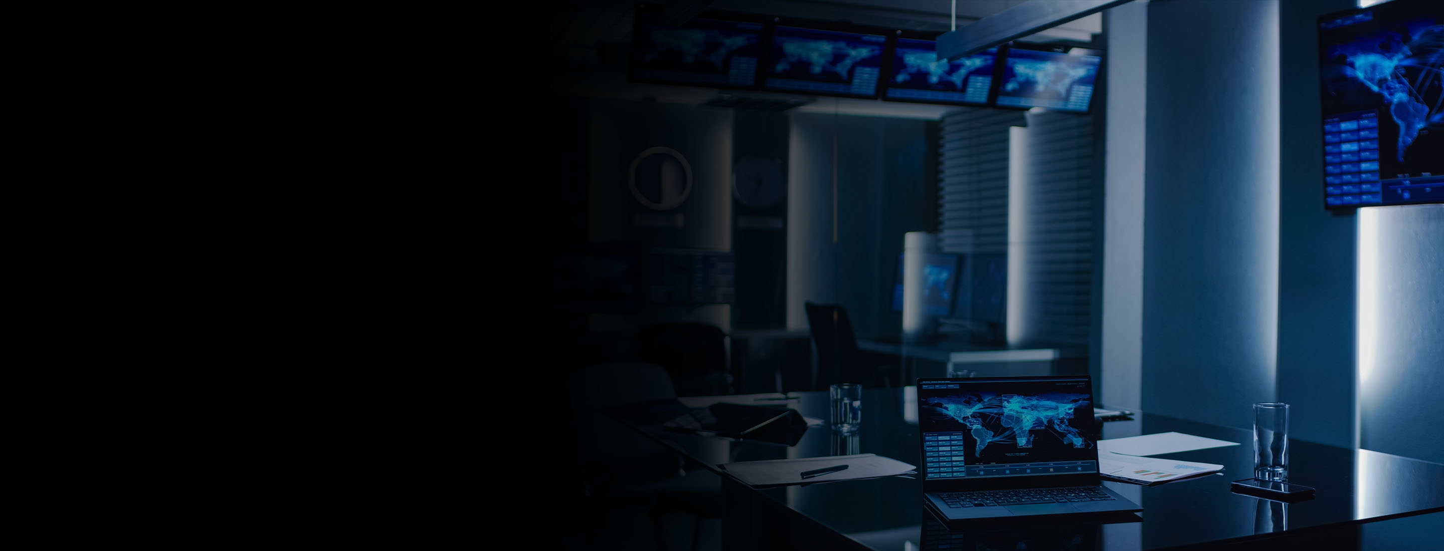 2880x1100 left black gradient of a shot of the System Control Monitoring Room. Empty Government Emergency Operations Center.