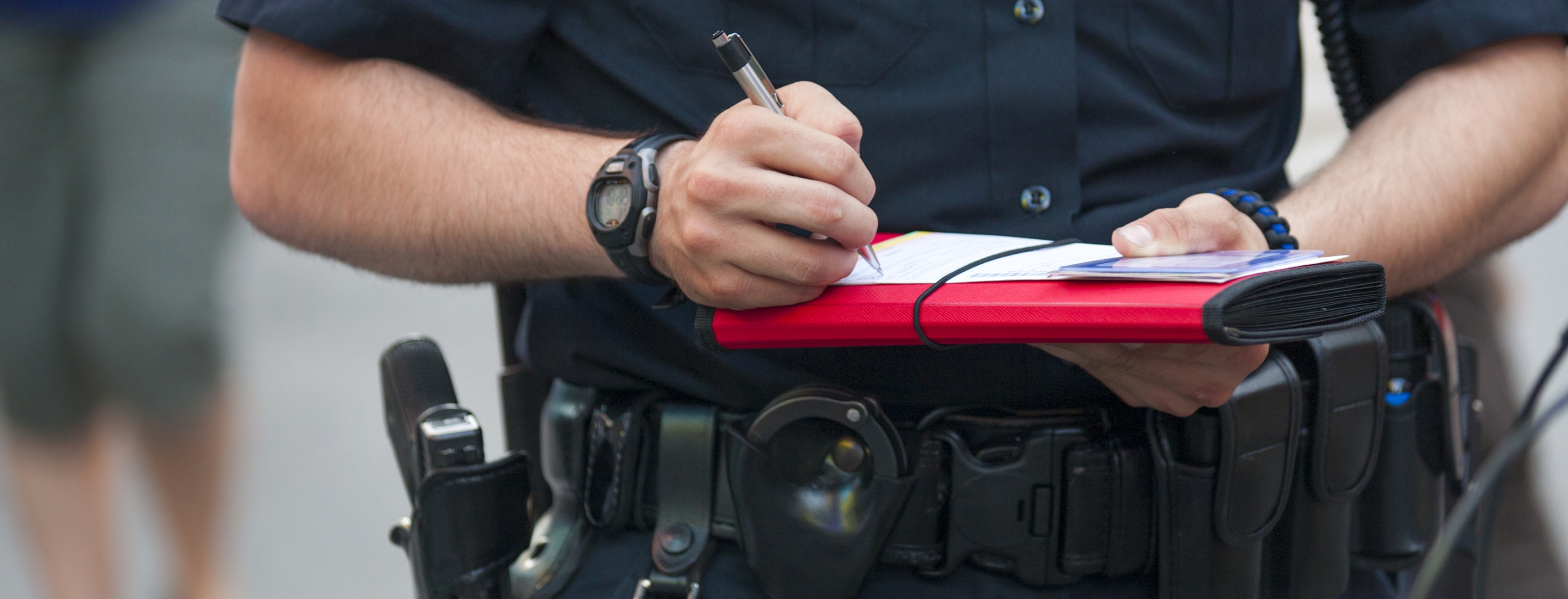 Cropped 2880x1100 flipped horizontal of police writes ticket