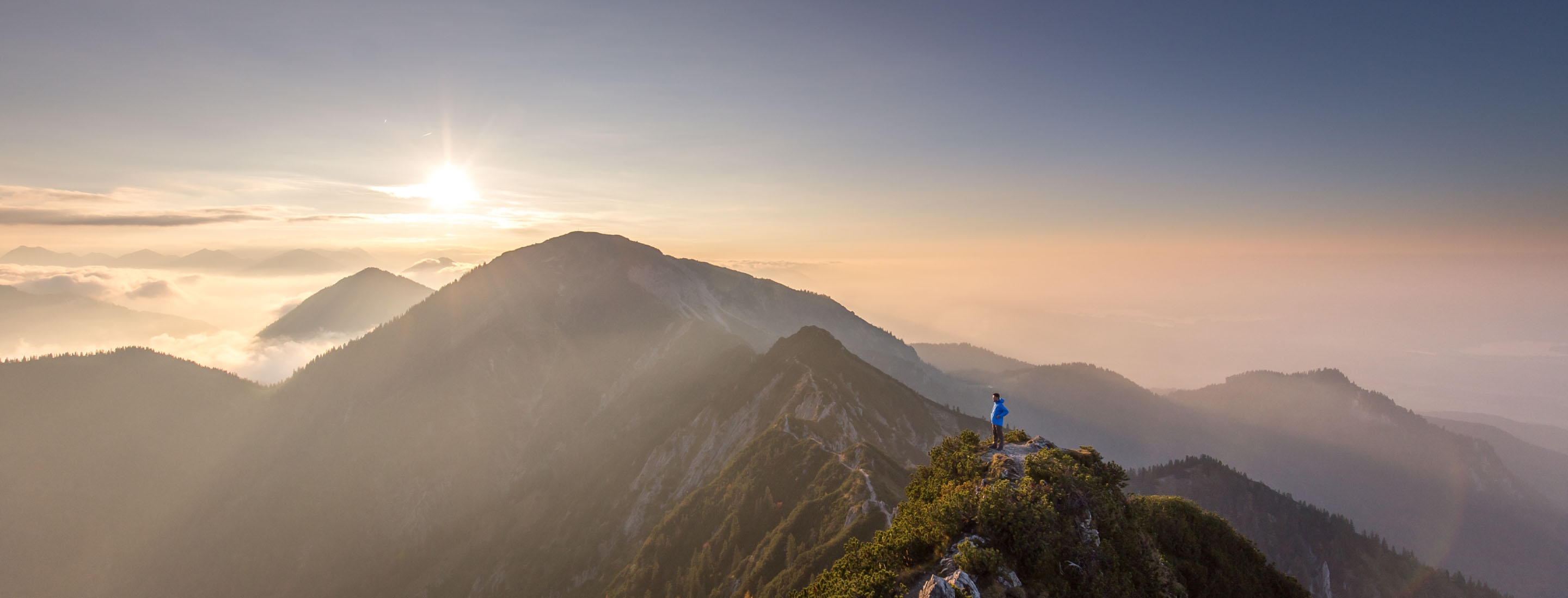 2880x1100 of man standing on Bavaria Alps - Herzogstand
