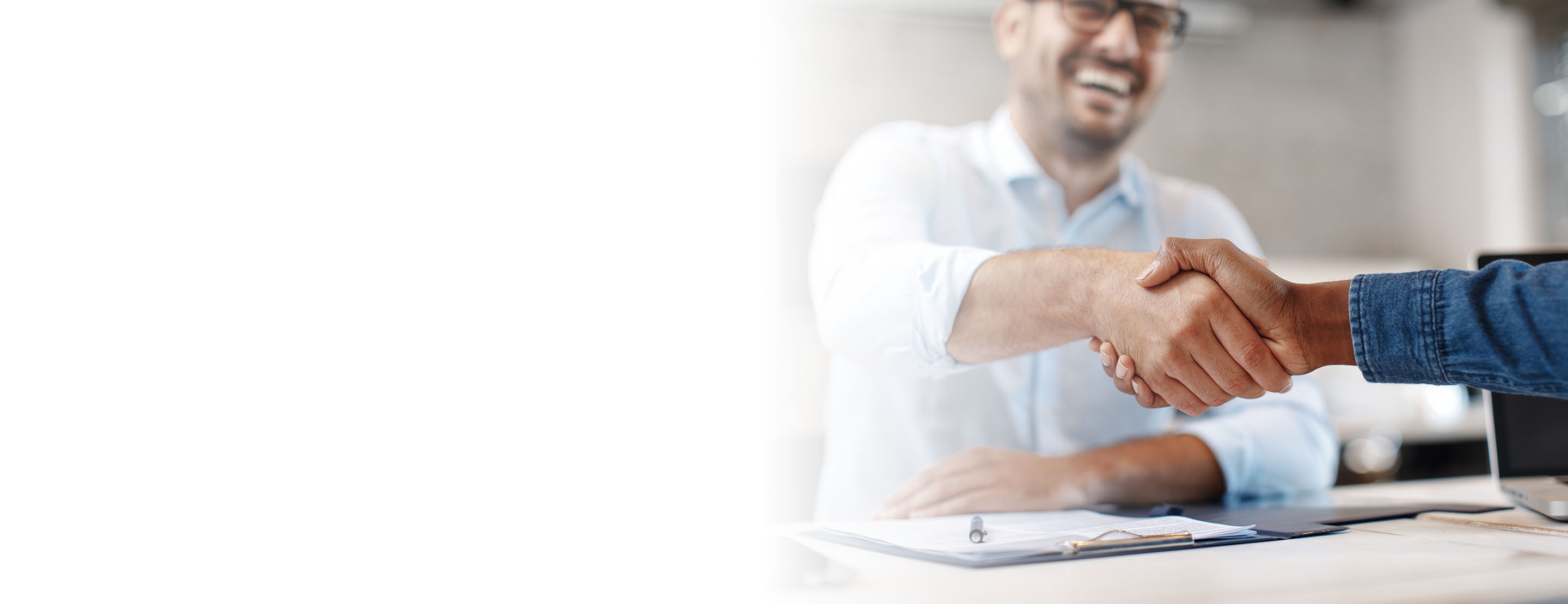 An at-will employee shaking their new boss’s hand.