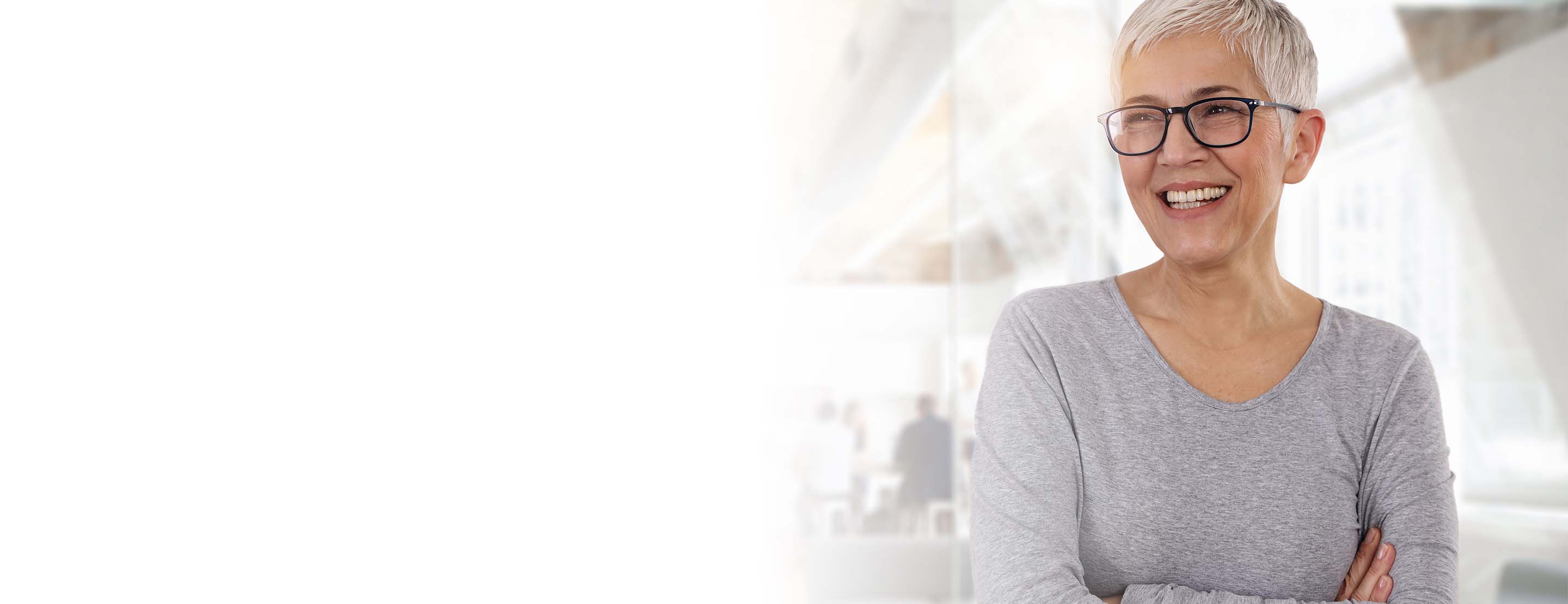 An ADEA-protected employee smiling in the office