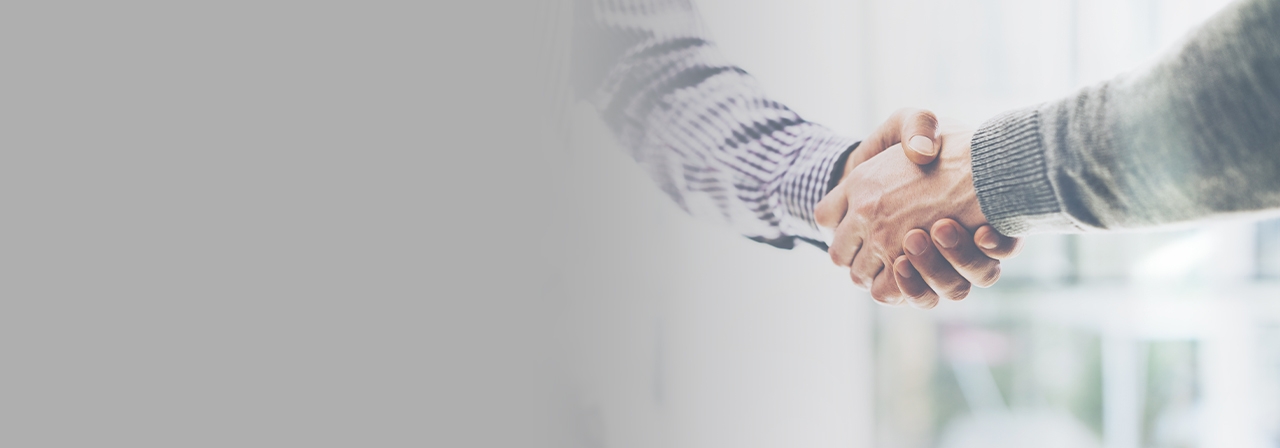 Cropped 1280x448 horizontal flipped left gray gradient of business partnership meeting concept. Image businessmans handshake. Successful businessmen handshaking after good deal. 