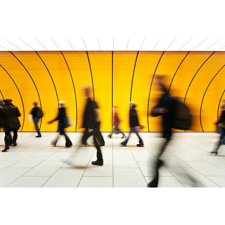 blurred and defocused people walking