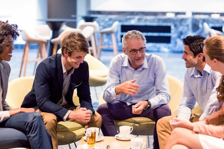 business-people-having-discussion-cafeteria
