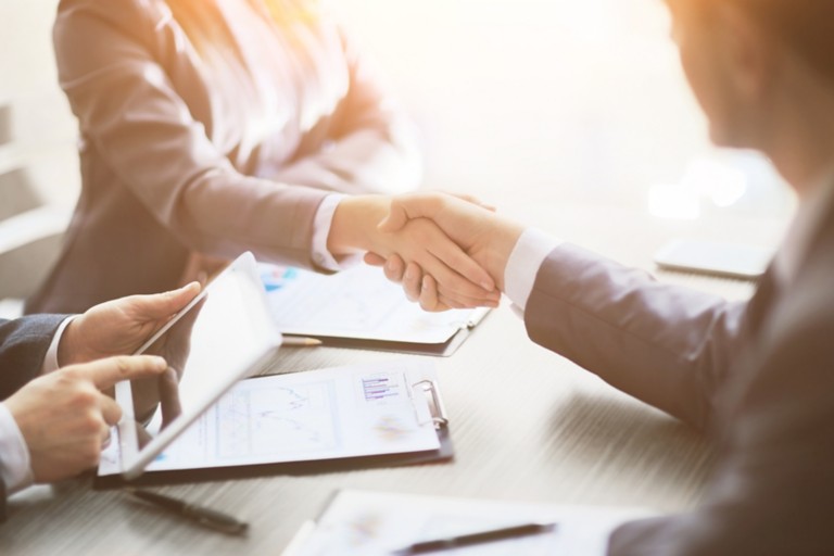 business-people-shaking-hands- finishing-meeting