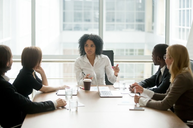 female-boss-leading-corporate-multiracial-team-meeting
