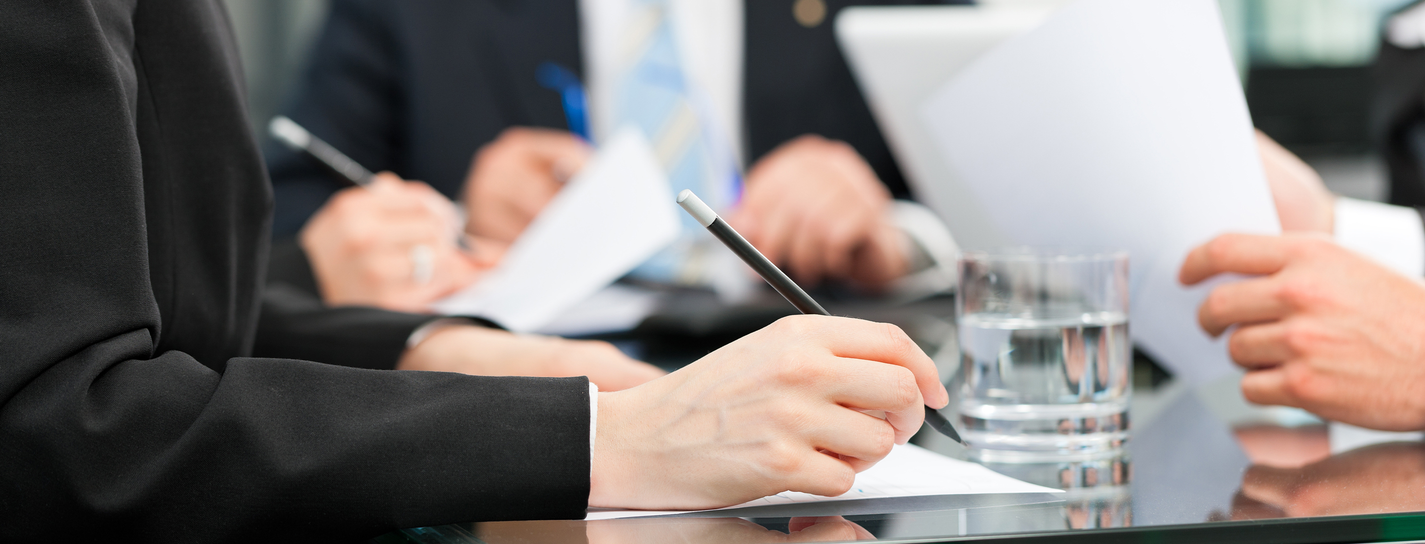 Business - meeting in an office, lawyers or attorneys discussing a document or contract agreement