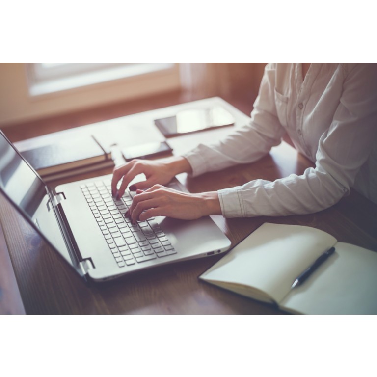 woman-workin-home-office-hand-on-keyboard