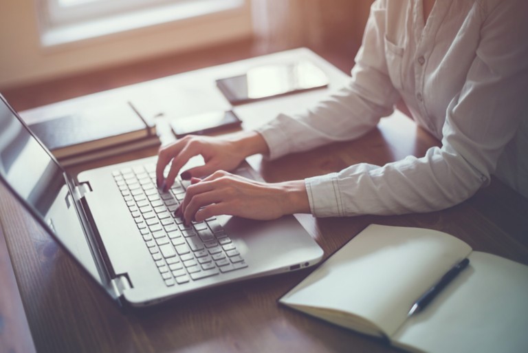 woman-workin-home-office-hand-on-keyboard