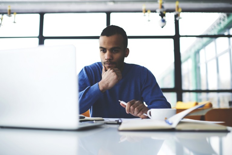 thoughtful-af-american-male-laptop-wifi