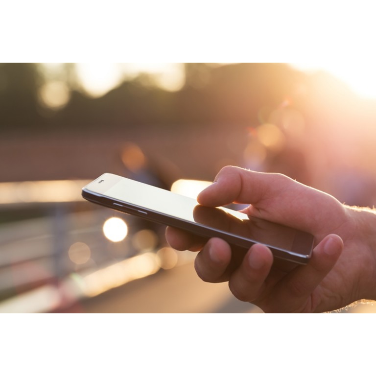 man-using-mobile-phone-outdoor-closeup