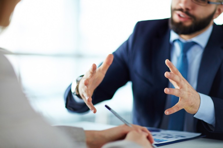 manager-showing-estimated-earning-growth-colleague