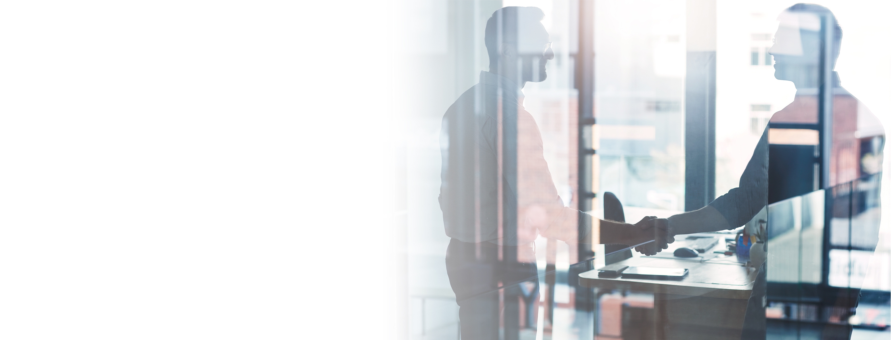 2880x1100 left white gradient of two businessmen shaking hands in an office